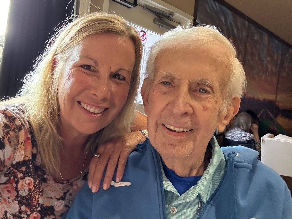 Dad and Kelley Irwin sitting close together with big smiles