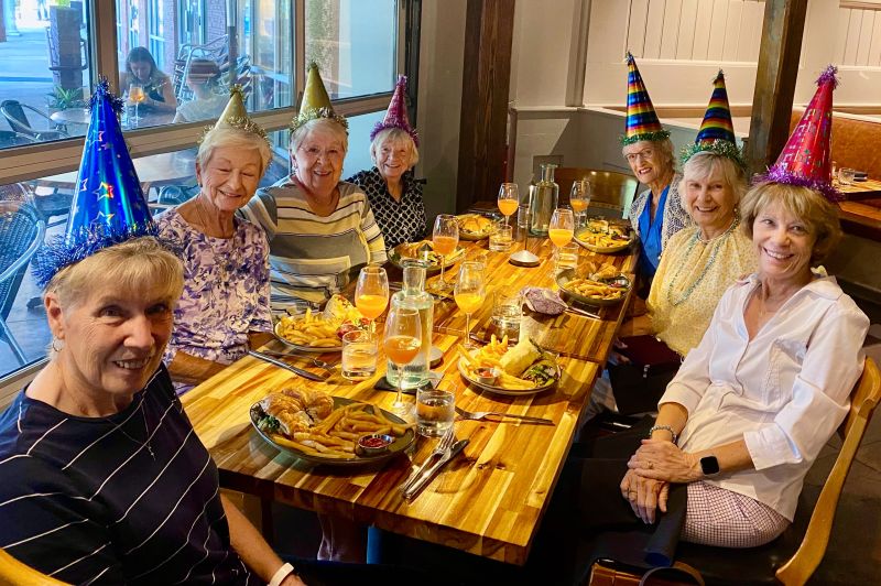 Mom sitting at her birthday lunch