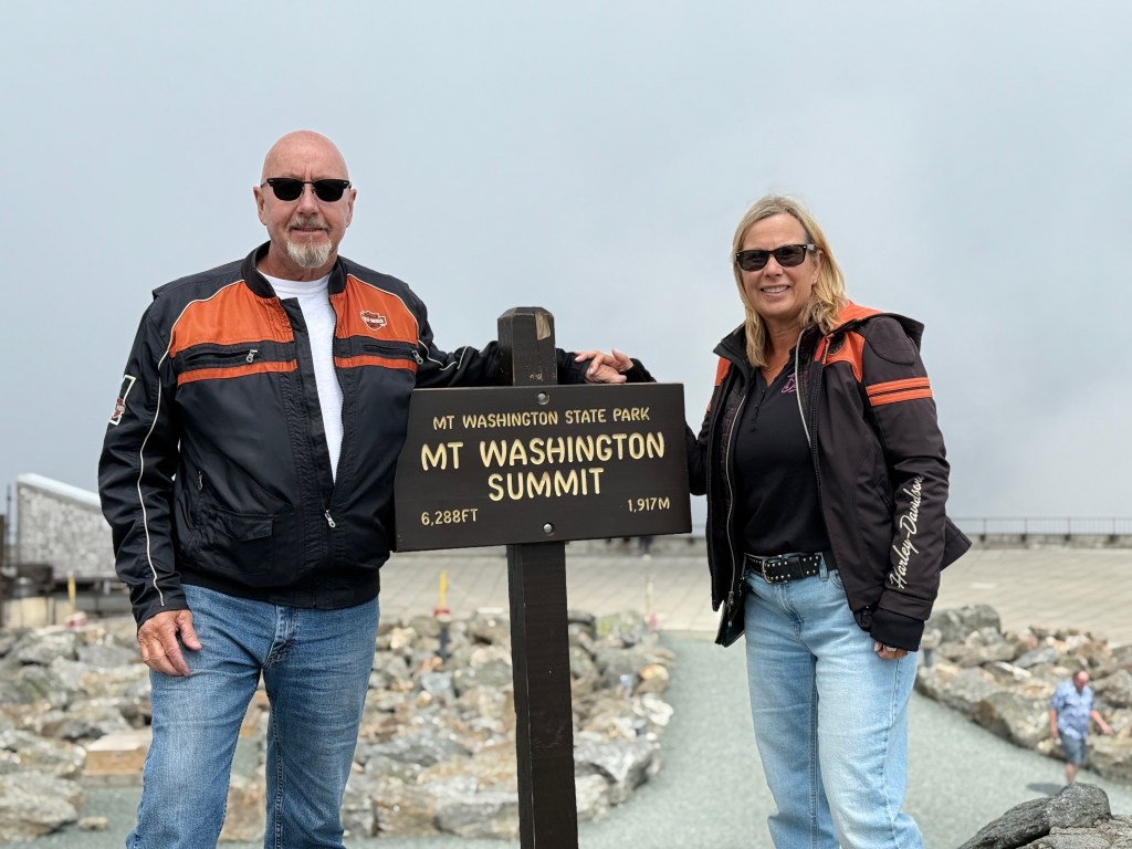 Les and Kelley standing at the top of Mt. Washington