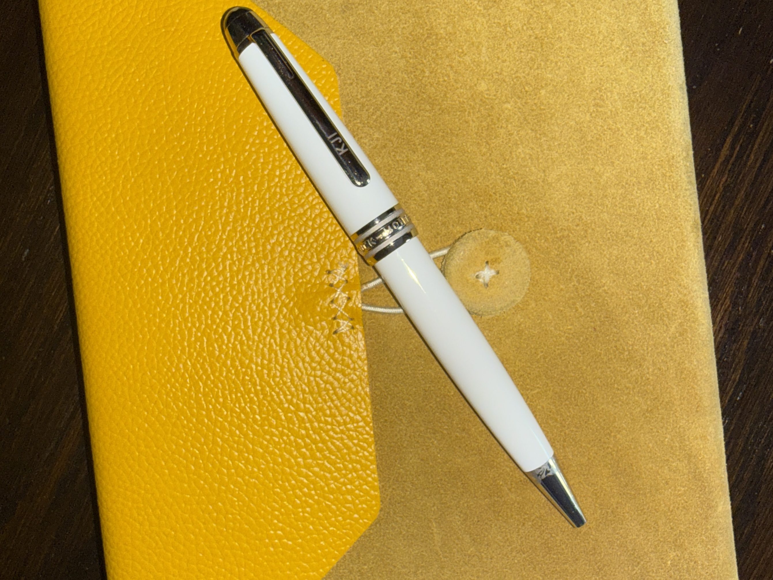 Kelley's yellow book and white Mont Blanc pen for writing books