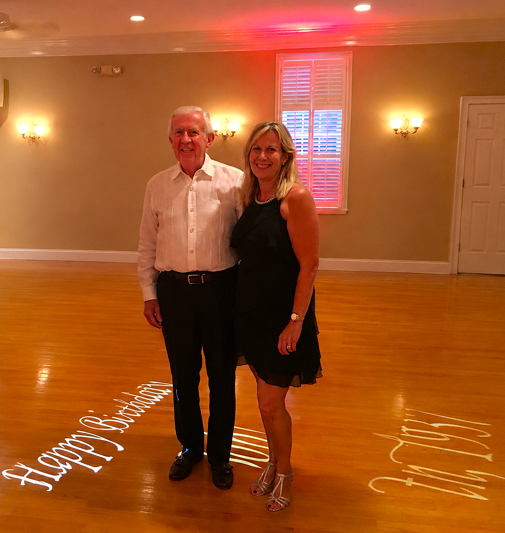 Dad and Kelley standing on a dance floor